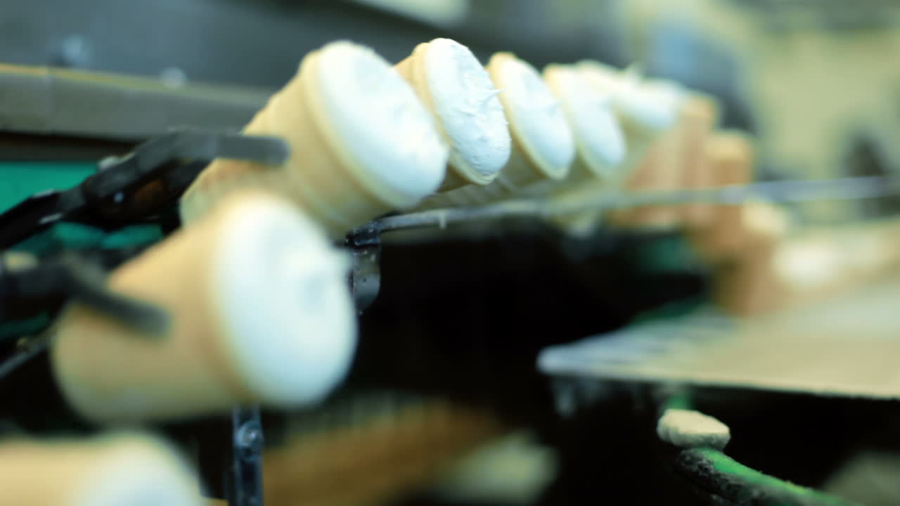 Ice cream production line. Row of ice cream on conveyor line. Food factory