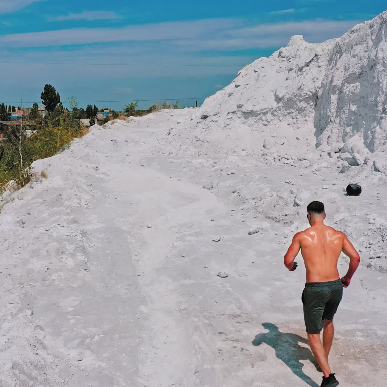 Sportive man training outdoors