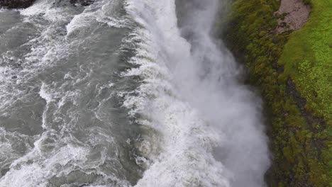 birdseye aerial view of gullfoss waterfall and canyon of hvita river, iceland, high angle drone shot 60fps