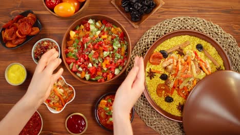 moroccan cuisine top view. tajine, traditional dish made of lamb and eggplant, vegetable salad. middle eastern culture. couscous with mutton close-up, delicious rice. homemade food.