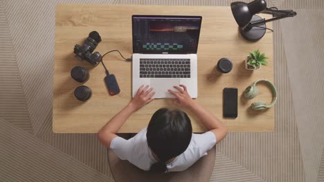 person working on a laptop for video editing