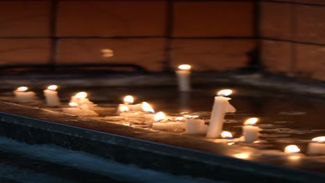 lit candles in a church