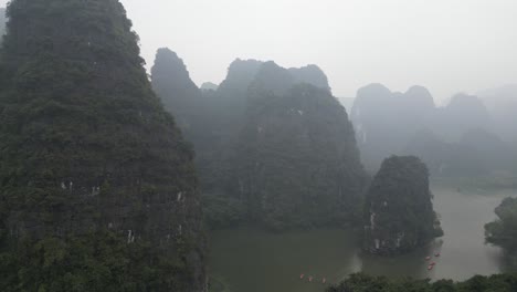 stunning aerial view of karst mountains and lake in vietnam
