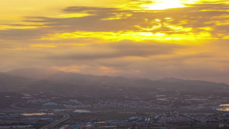 Malaga-sunset-landscape,-sundown-time-lapse-Spanish-golden-hour-clouds