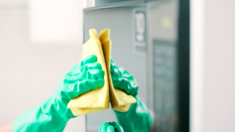 cloth, hands and person cleaning microwave