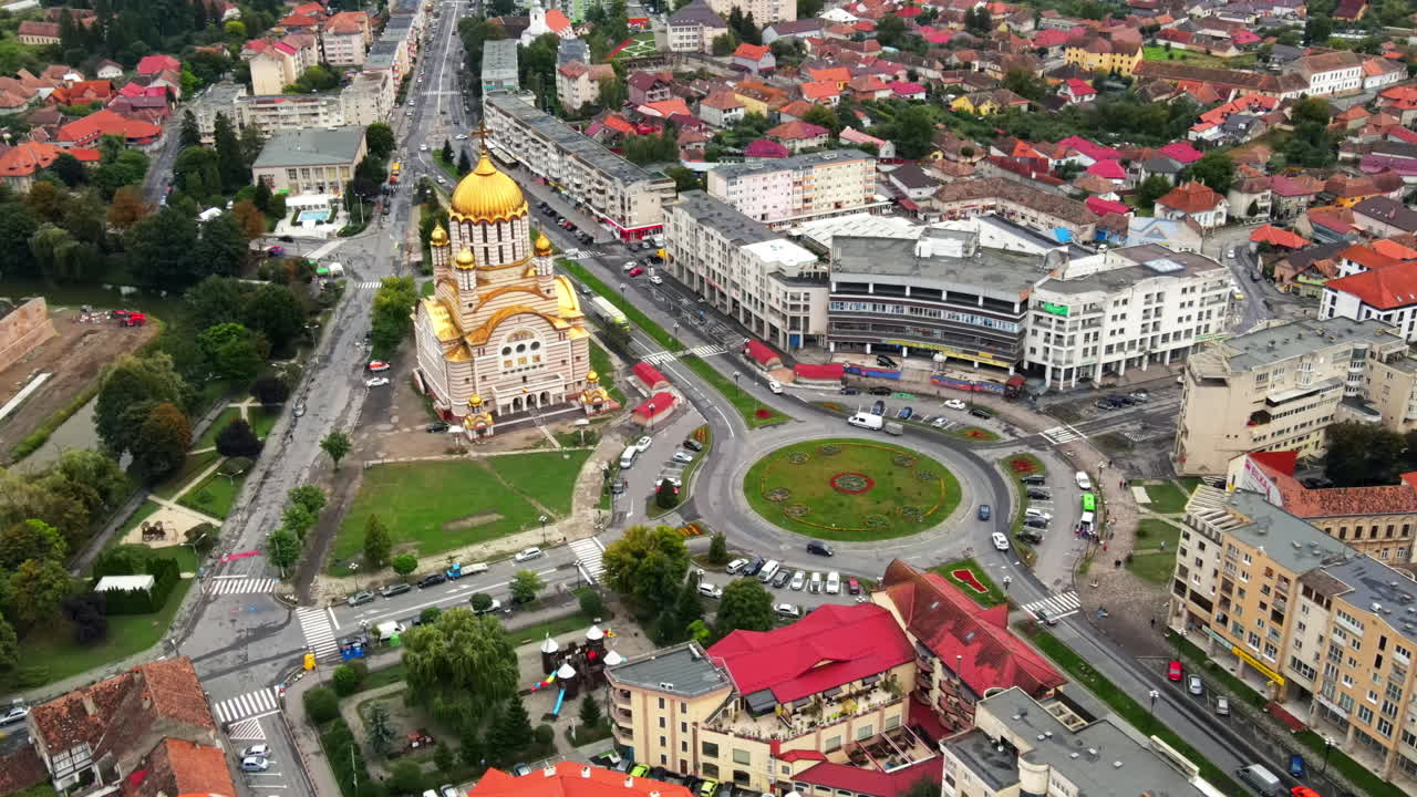 Aerial drone view of the Fagaras, Romania. Church of the Saint John the Baptist and Fagaras Citadel, multiple buildings, roads