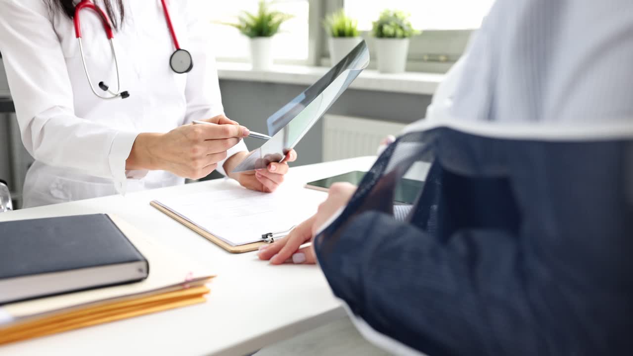 Doctor examining patient's x-ray