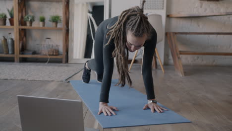 Woman Doing Plank Exercise at Home