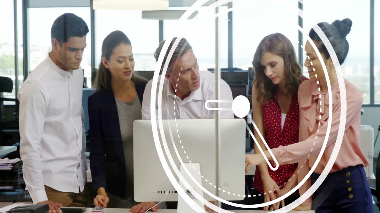 Collaborating at computer, business team with clock animation overlay in office