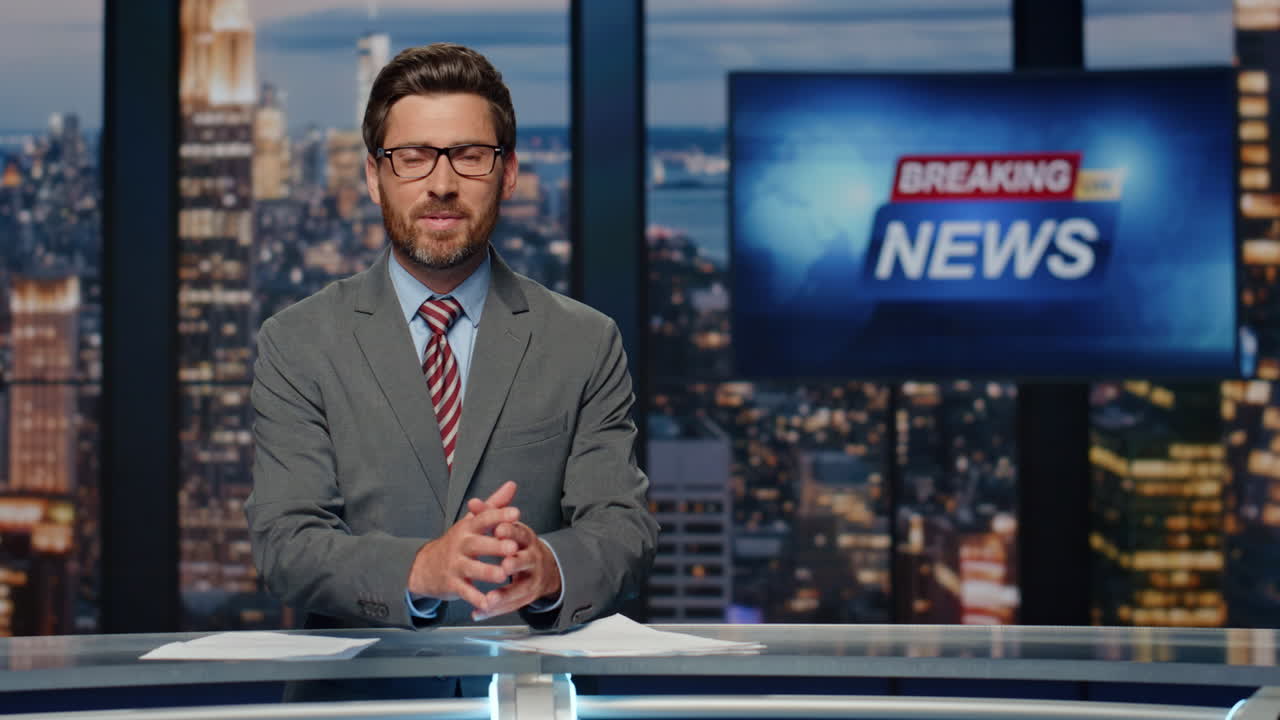 Smiling newscaster reporting business information in studio. Anchor man talking