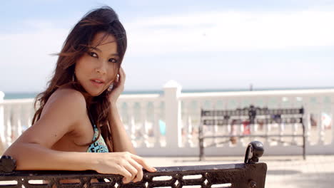 pretty happy young woman relaxing at the seaside