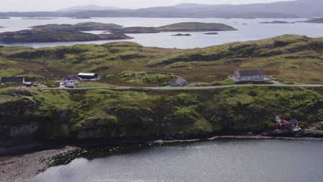 Wide-angle,-descending-drone-shot-of-the-Isle-of-Scalpay,-an-island-near-the-Isles-of-Harris-and-Lewis-on-the-Outer-Hebrides-of-Scotland