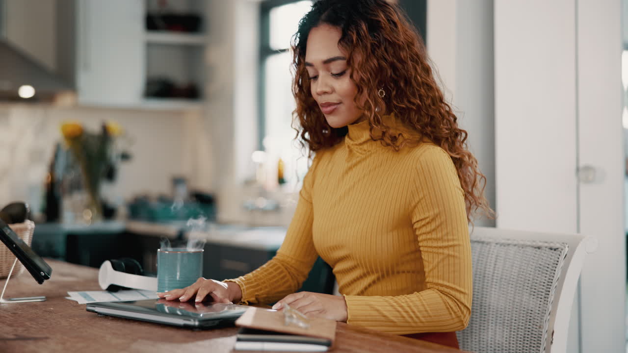 Woman working on her laptop at home