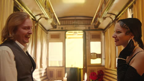 couple arguing in a vintage train compartment