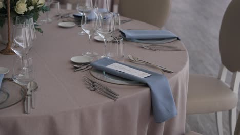 refined wedding table setting with soft linens and flowers