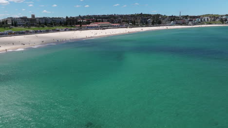 flight over the turquoise ocean of bondi beach in sydney, new south wales, australia - drone shot