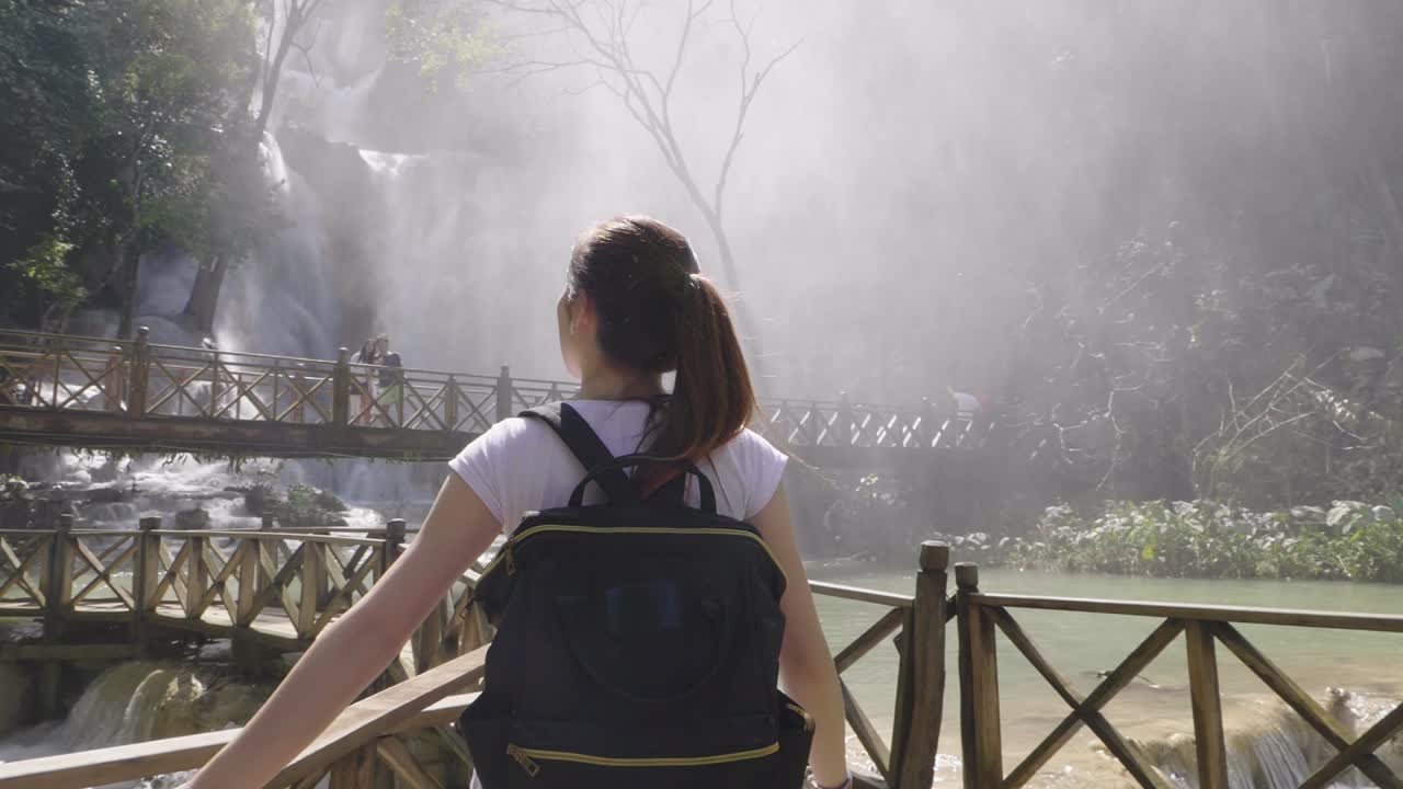 Woman Exploring Waterfall