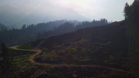 A-beautiful-overhead-snapshot-of-a-lush,-green-forest-with-an-amazing-view-of-a-stormy-sky-covered-with-tons-of-heavy-clouds