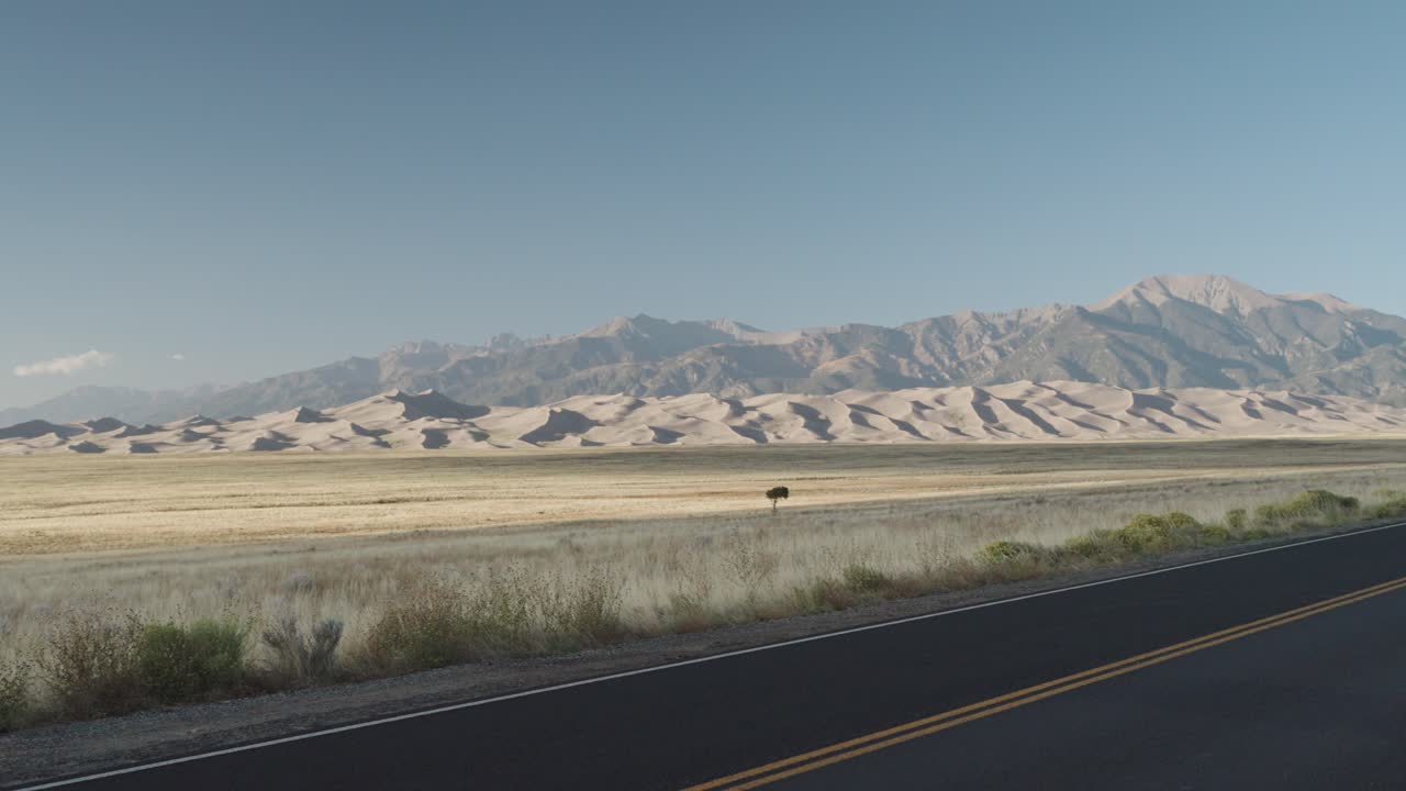 Sand Dunes and Mountains Landscape