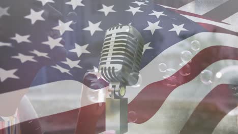 Animation-of-flag-of-usa-over-african-american-mother-and-son-blowing-bubbles-and-retro-mic