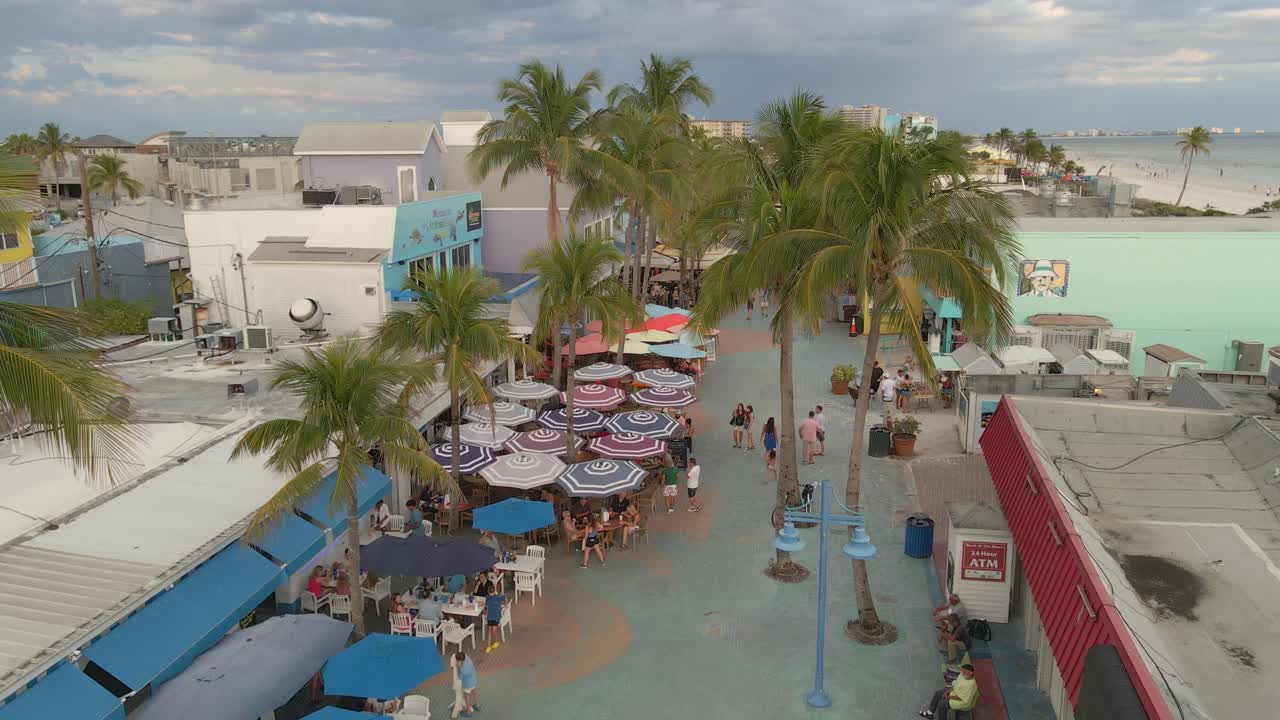 Times square in Fort Myers Beach, Florida full of people