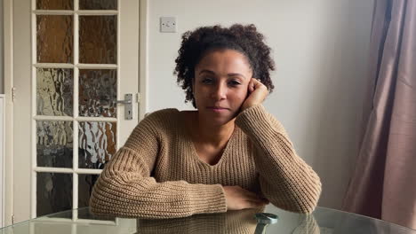 young woman on video call listening to a friends story directly into camera