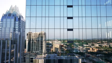 modern city skyline with glass skyscrapers and reflections