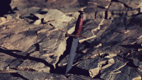 Excalibur-sword-in-rocky-stone-at-sunset