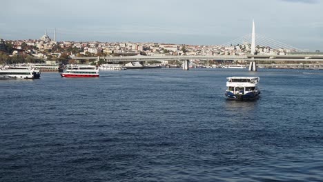 istanbul, turkey with boats and a bridge in the foreground