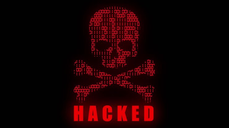 Graphisme animé high-tech, avec un thème de code binaire animé, un motif de tête de mort et tibias croisés rouge de style hacker high-tech et un texte "Hacked" clignotant, sur fond noir.