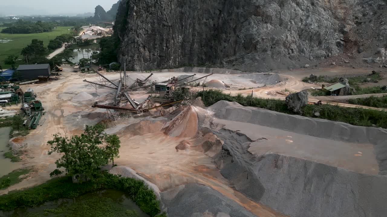 Aerial view of a limestone quarry with processing equipment