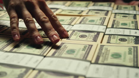 specialised police officer counting dollar banknotes in crime lab, conceptual image. high quality 4k footage