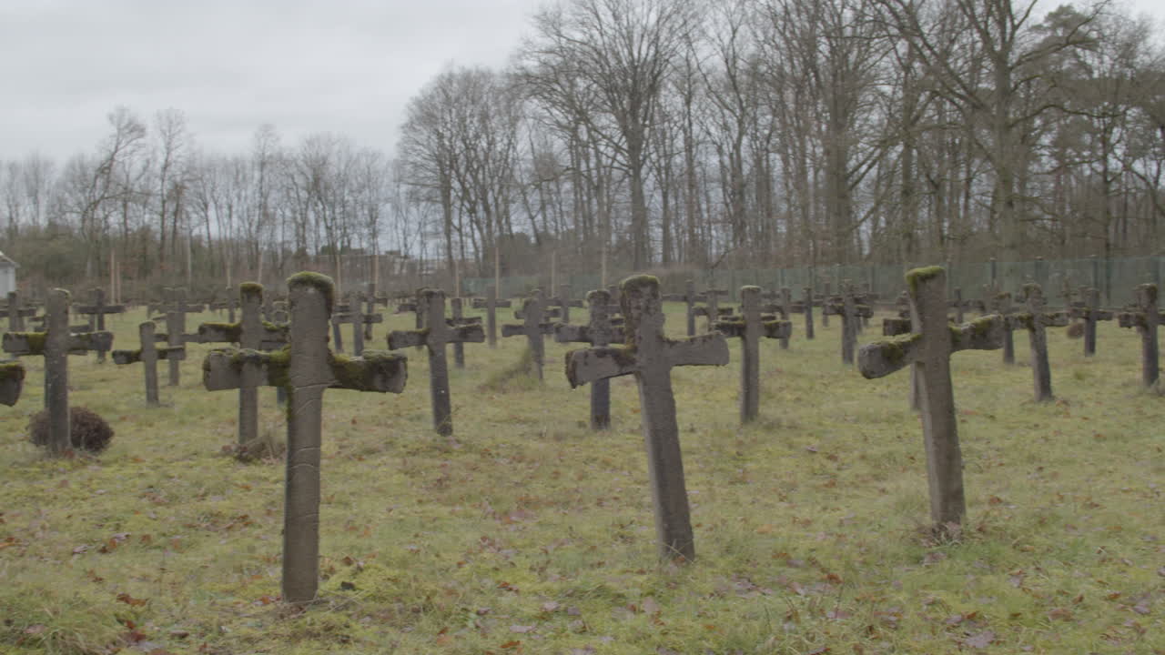 Wide overview of old gravestones at abandoned graveyard