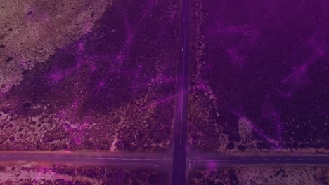 3d render t-shaped road intersection showing two white cars driving through purple haze