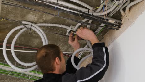 electrician working on electrical wiring system