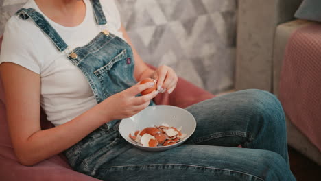 woman peeling an egg