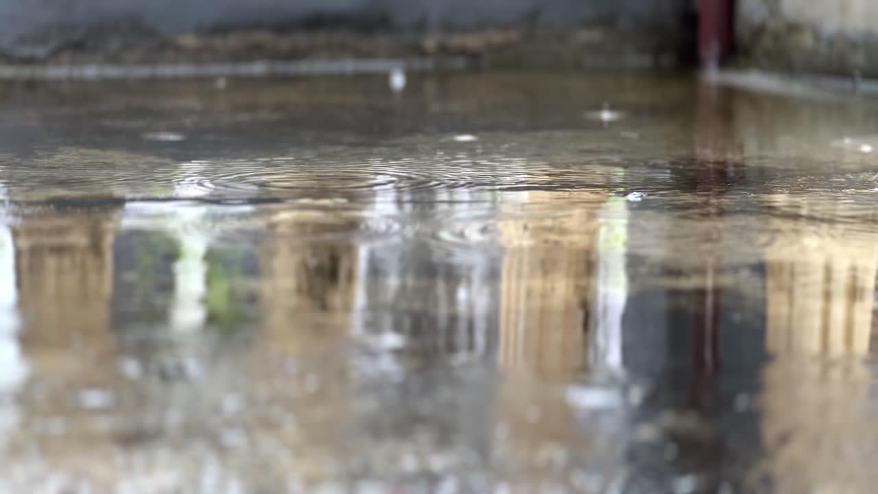 Rainy season. Puddles of water in rainy day