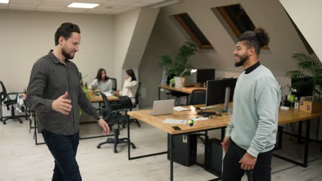 Diverse-multiracial-businessmen-two-partners-in-office-make-greeting-gesture-clapping-hands-give-five