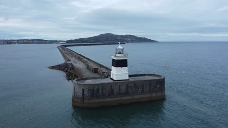 holyhead breakwater lighthouse longest concrete coastal sea protection landmark aerial view slow ascending shot