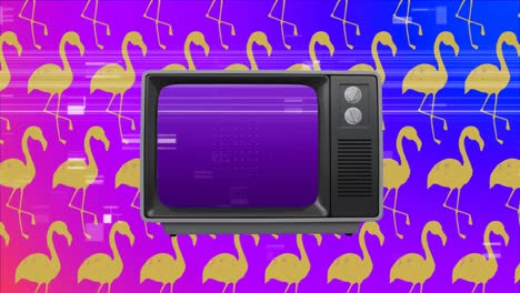 Old-television-against-wallpaper-yellow-flamingos-in-background