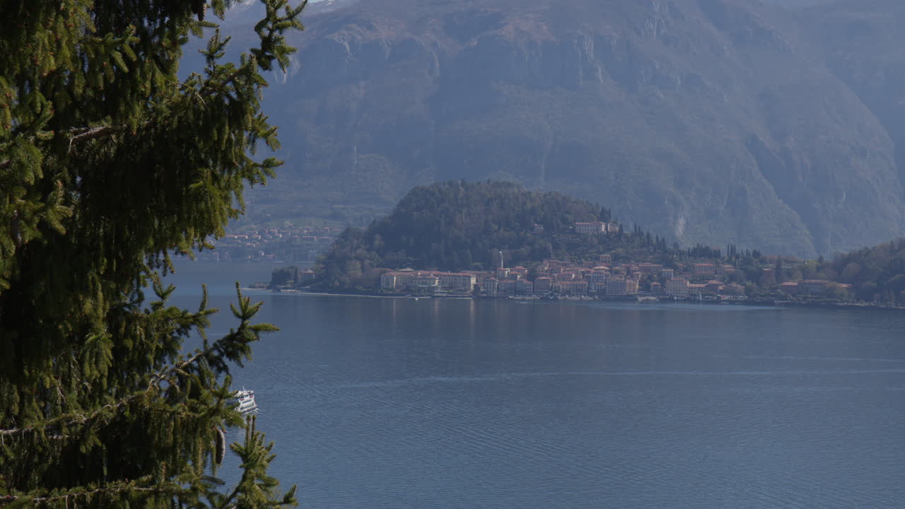Cruise Ship Over Lake Como With Bellagio Town In The Background In Italy. Wide Shot