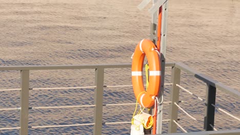 lifebuoy hang on the pier in the sea. marina bay equipment.