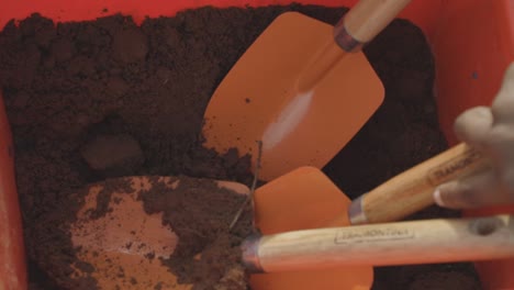 gardening activity with shovels and soil