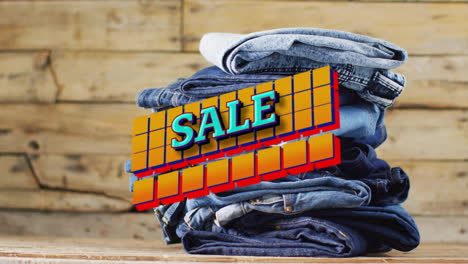 animation of sale text over denim trousers on wooden background