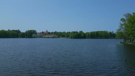 majestic aerial top view flight vacation paradise village chlum at lake hejtman in czech summer day 2023