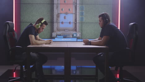 two gamers facing off in a competitive gaming session