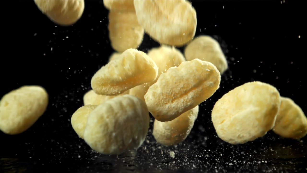 Slow Motion of Gnocchi Falling onto a Black Surface