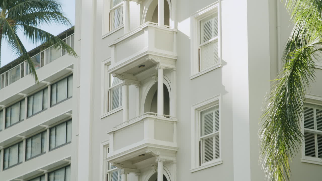 Reflections of Tropical Cityscape in a Vehicle Window