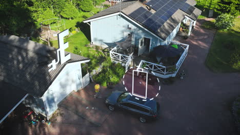 man plugging in, charging a ev car at a solar powered house - motion graphics