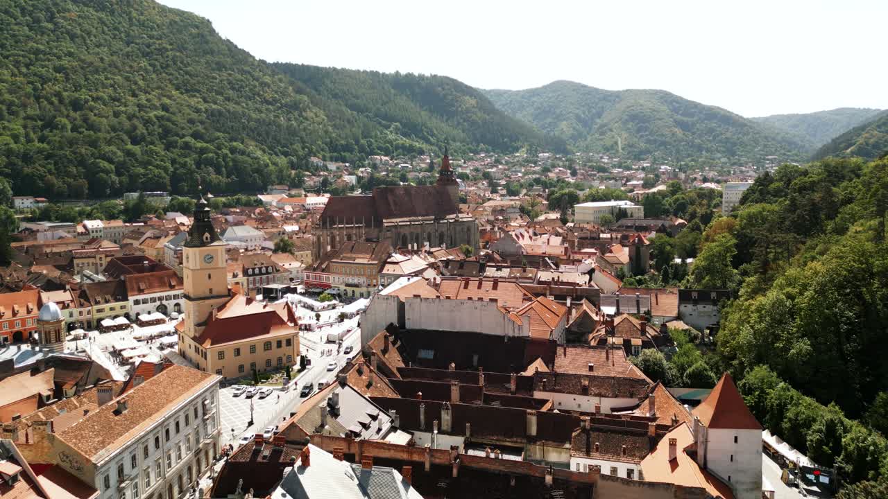 Brasov Main Square And Old Town Hall (Piata Sfatului), Central Romania, Transylvania Region. Aerial Drone Shot